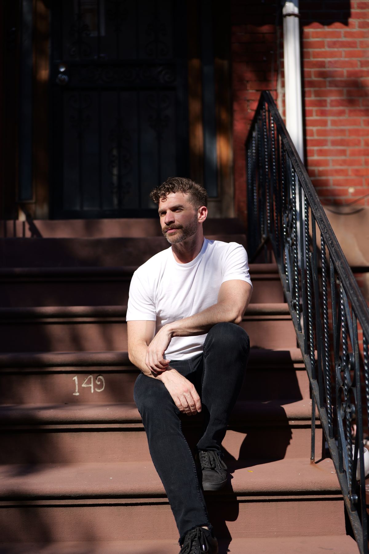 Fresh Clean Threads — editorial portrait on a Chelsea stoop