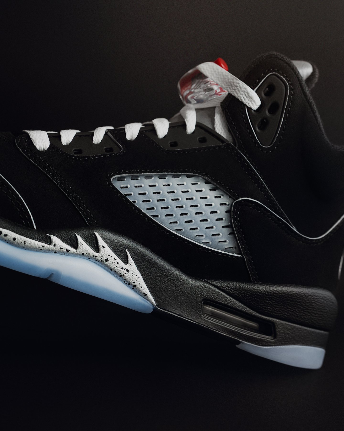 Sneaker shoot: Close detail of the black pair against a dark backdrop