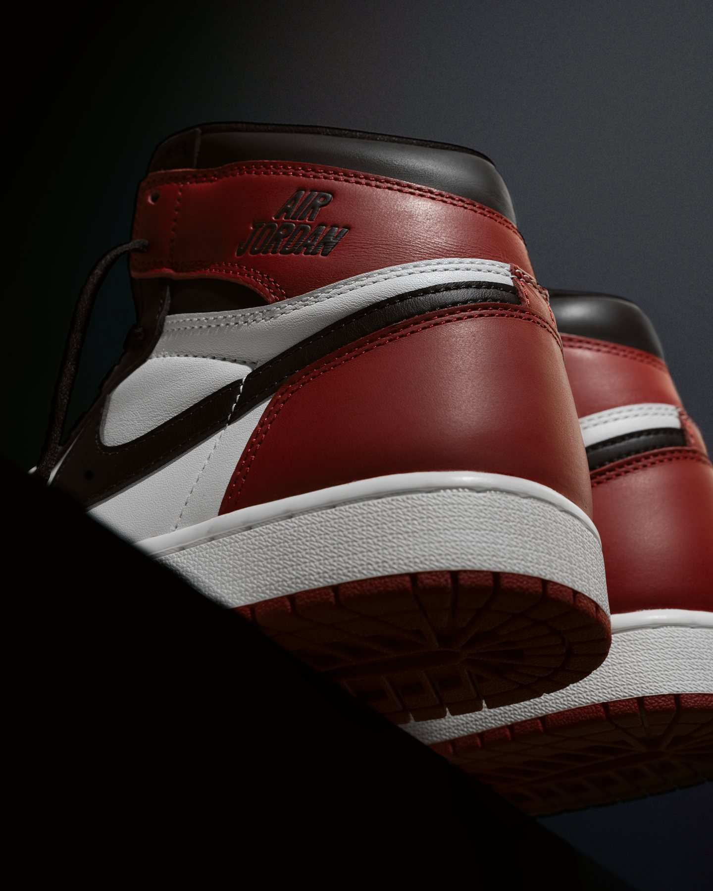Sneaker shoot: Close detail of the red pair on a dark set